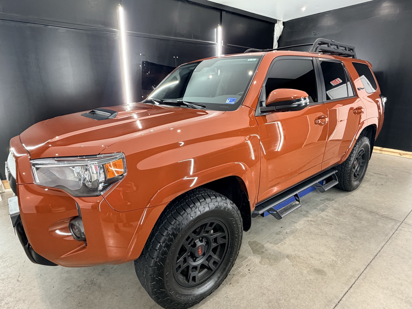 Orange Toyota 4Runner TRD Pro with tinted windows