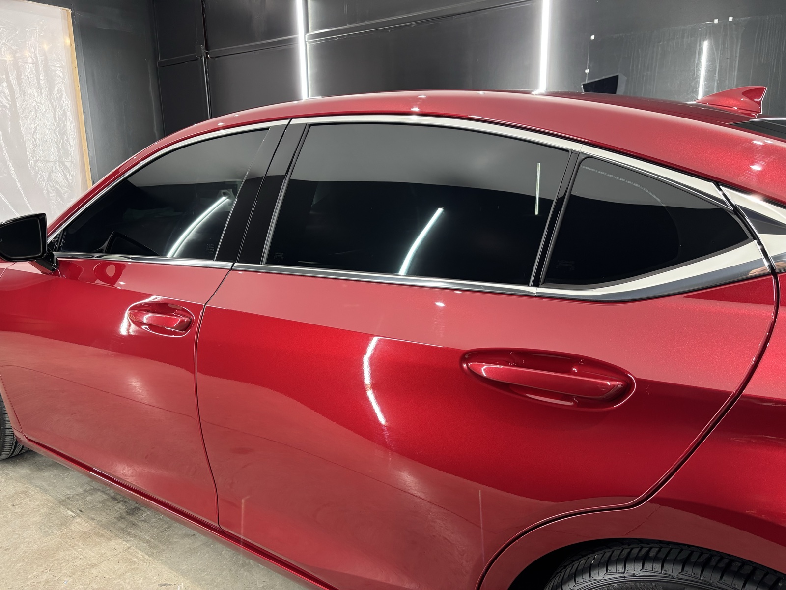 Red BMW with fresh side window tint