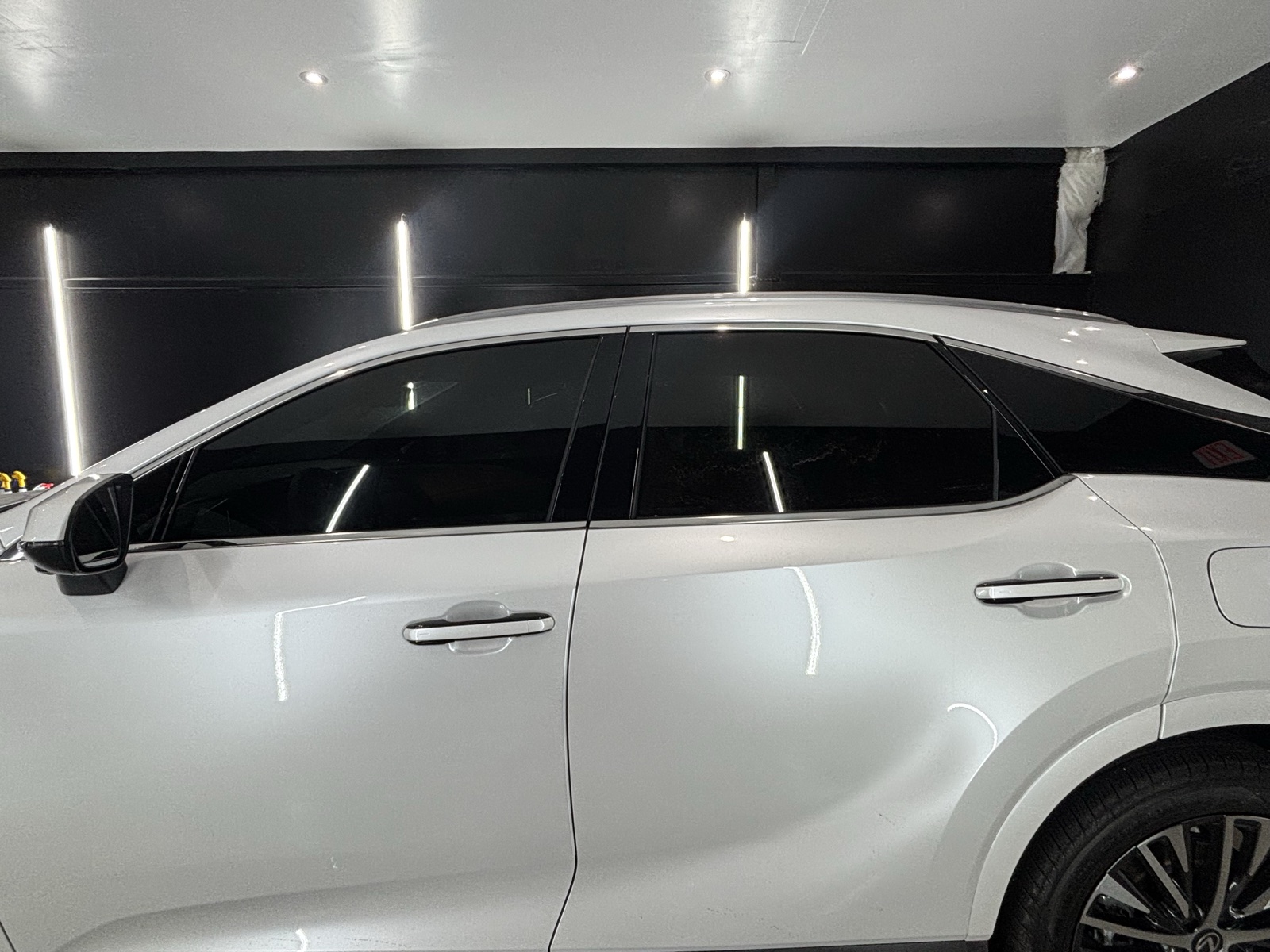White Lexus RX with fresh window tint in the Coastal Details bay